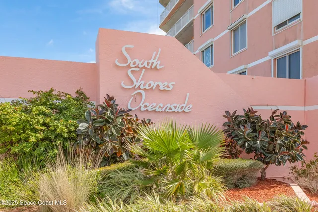 a sign that is on a brick building