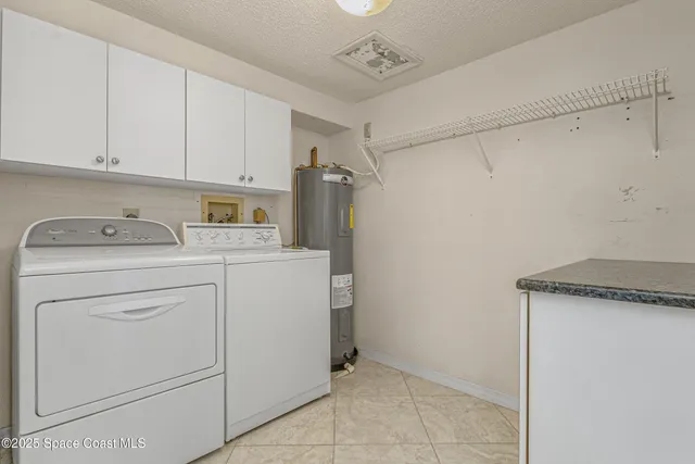 a bathroom with a granite countertop toilet a sink and a mirror