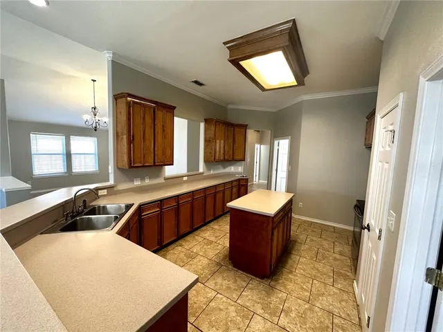 a bedroom with a bed and glass door