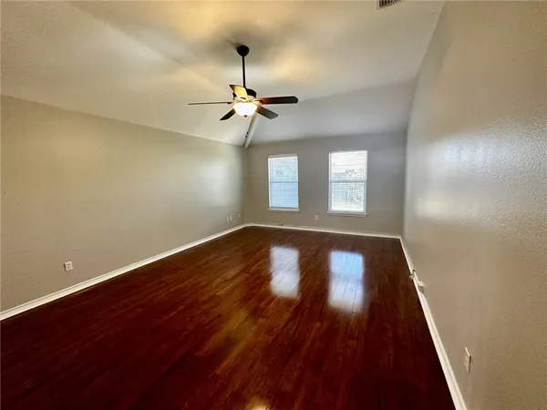 a spacious bathroom with a granite countertop sink and a mirror
