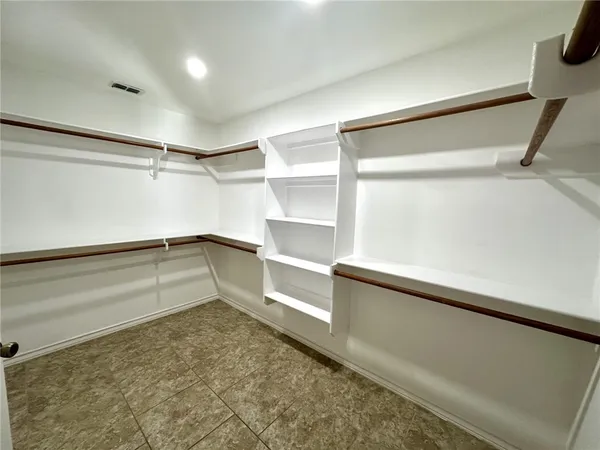 a room with a sink and a mirror