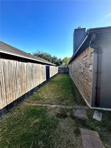 a view of a backyard with a patio