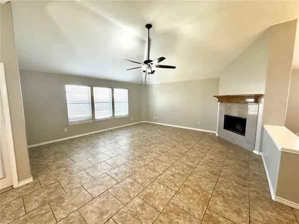 a view of a kitchen with a sink and a fireplace