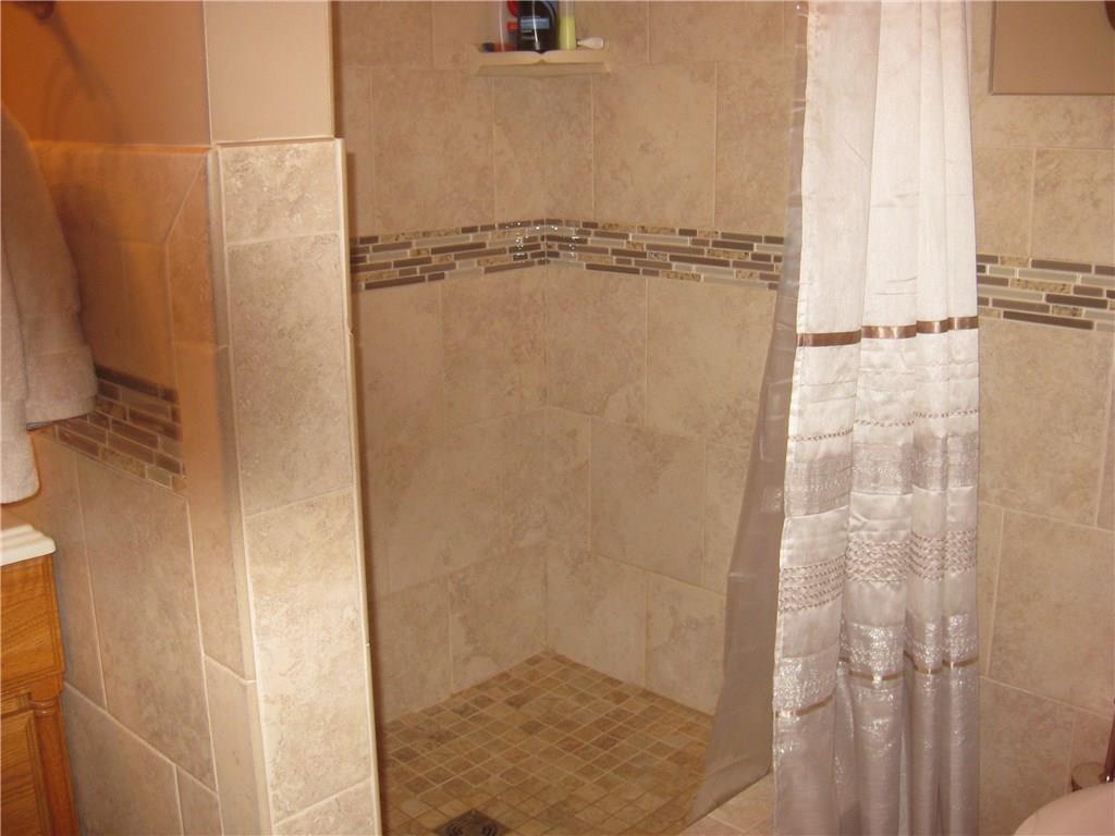 1475 Plain Grove Road Volant, PA 16156 - Photo 11 of 25 Full bath on the main floor....showing fabulous tile in the shower stall!