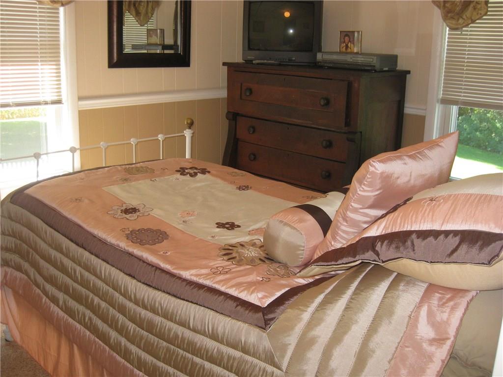 1475 Plain Grove Road Volant, PA 16156 - Photo 21 of 25 Bedroom #4 is boasts a chair rail to separate the neutral colors!