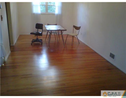 38 Partch Place Edison, NJ 08817 - Photo 3 of 7 a view of a workspace with furniture and a window