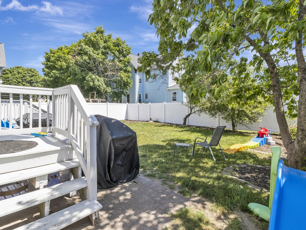 13 Shawmut Avenue, Unit 13 Mansfield, MA 02048 - Photo 27 of 34 a view of a garden with a tree