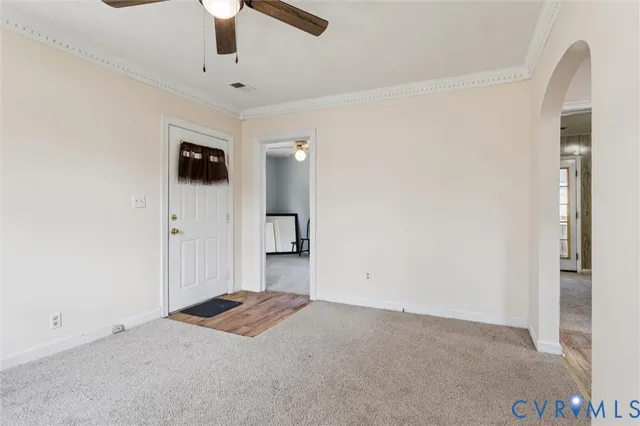 a view of a kitchen with a sink and a refrigerator
