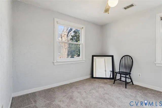 a view of a livingroom with furniture and a piano