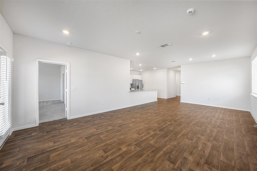 121 Mackinac Lane Georgetown, TX 78626 - Photo 4 of 16 a view of an empty room with wooden floor