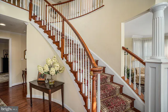 a view of an entryway wooden floor and front door