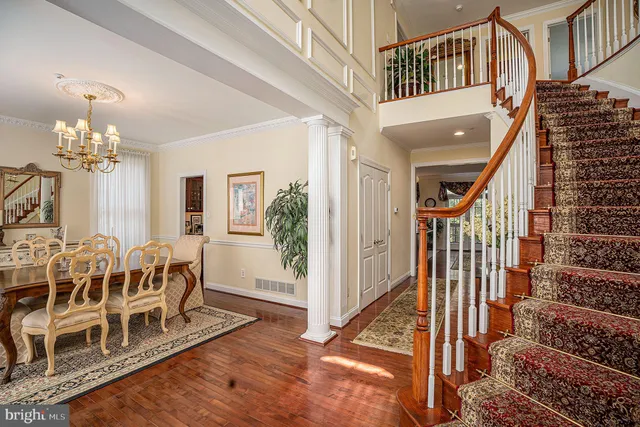 a view of a livingroom with furniture and stairs