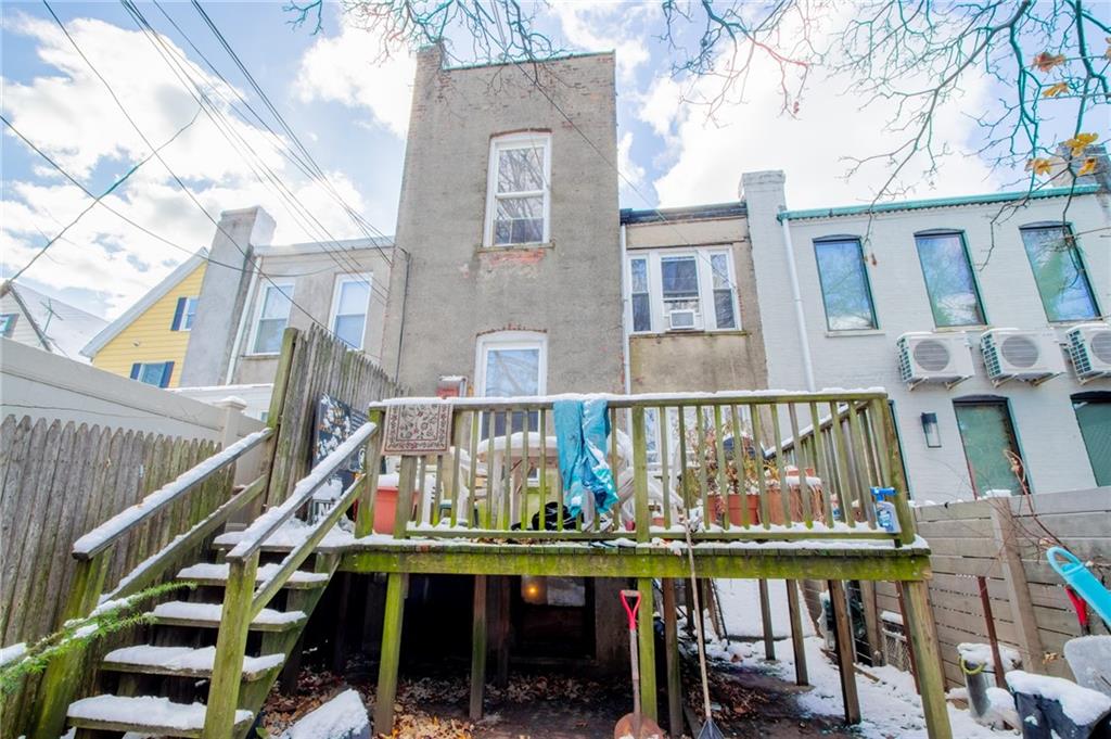 525 76th Street Brooklyn, NY 11209 - Photo 3 of 8 a view of balcony with two chairs and wooden fence