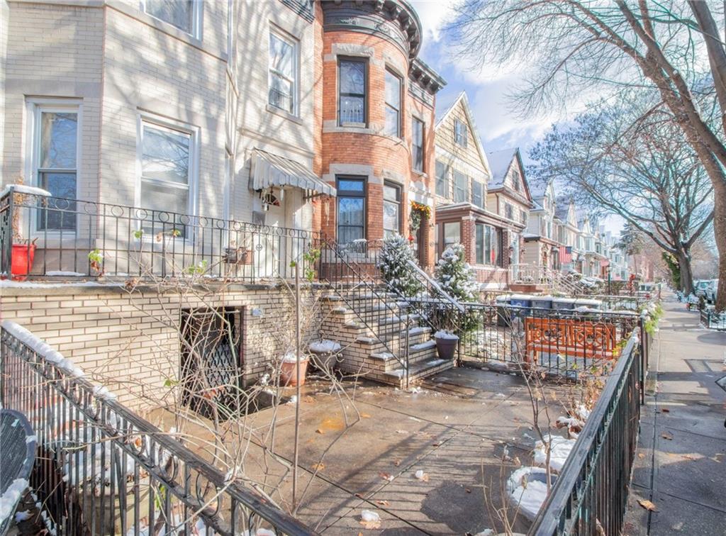 525 76th Street Brooklyn, NY 11209 - Photo 6 of 8 a view of a patio with couches and wooden fence