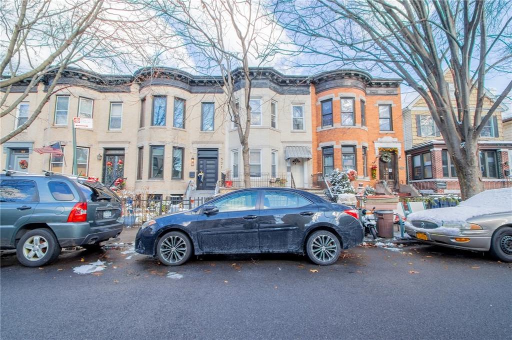 525 76th Street Brooklyn, NY 11209 - Photo 7 of 8 a car parked in front of a white house