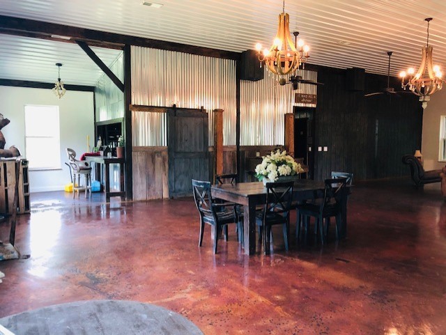 248 Access Road Pulaski, TN 38478 - Photo 9 of 19 a view of a dining room with furniture window and wooden floor
