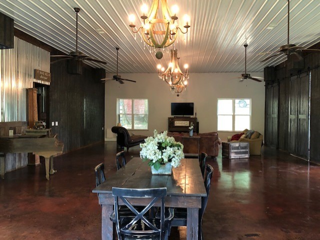 248 Access Road Pulaski, TN 38478 - Photo 10 of 19 a dining room with furniture a chandelier and wooden floor