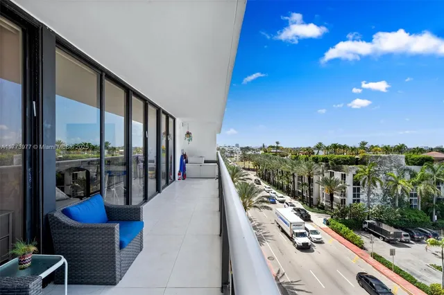 a view of balcony with furniture