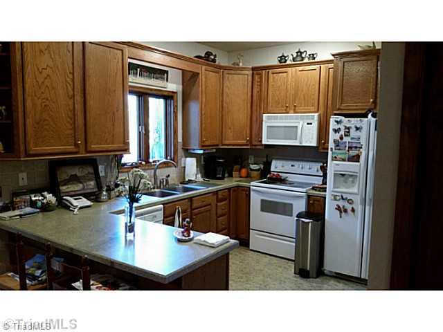 9075 Broad Street Rural Hall, NC 27045 - Photo 18 of 23 Kitchen. Oak cabinets with all appliances