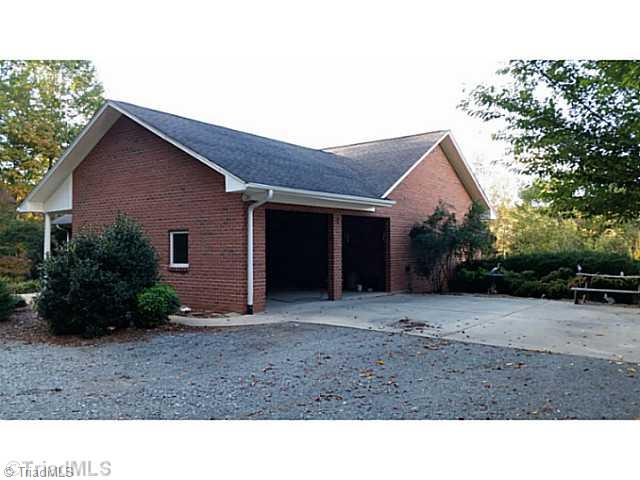 9075 Broad Street Rural Hall, NC 27045 - Photo 8 of 23 Exterior Back. Open garage area