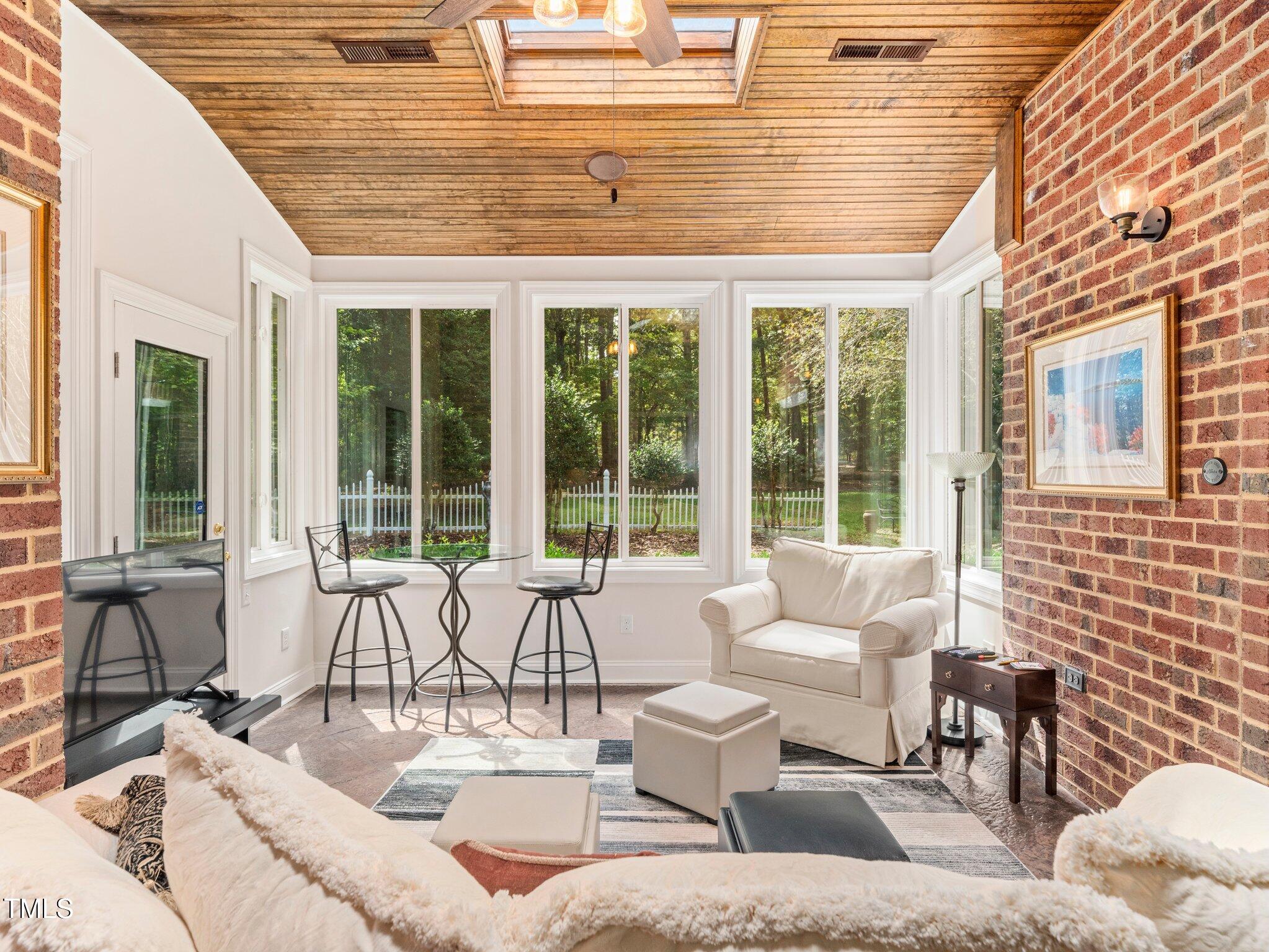 10937 Cahill Road Raleigh, NC 27614 - Photo 25 of 53 The Cozy Sunroom has Tons of Charm