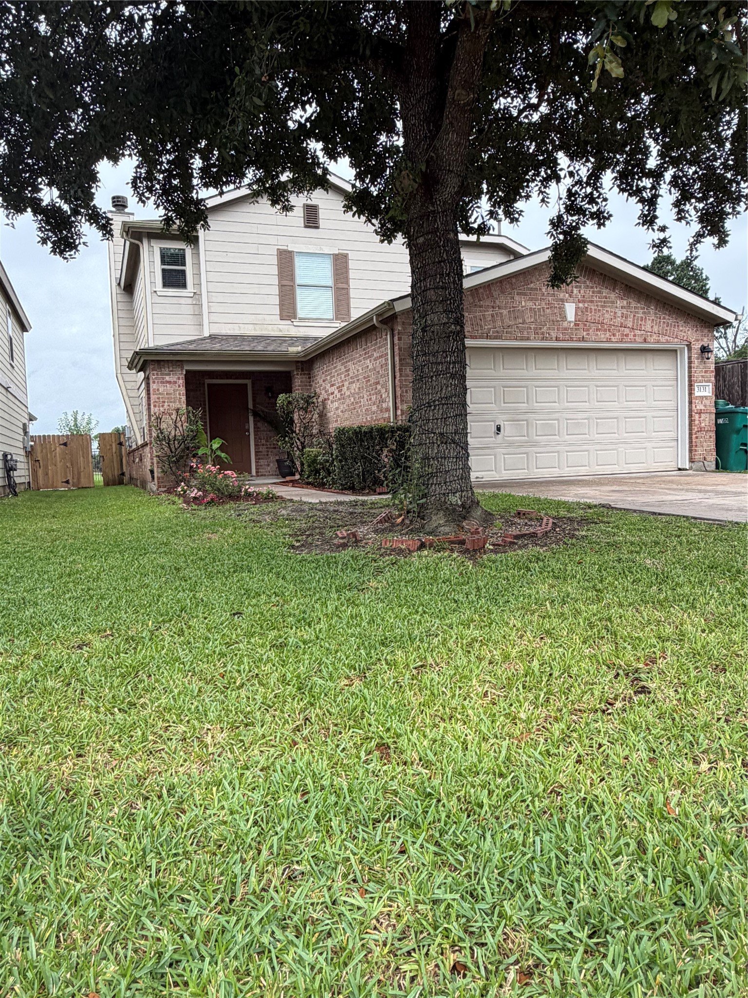 3131 Peachstone Place Spring, TX 77389 - Photo 5 of 20 a front view of a house with a yard and garage