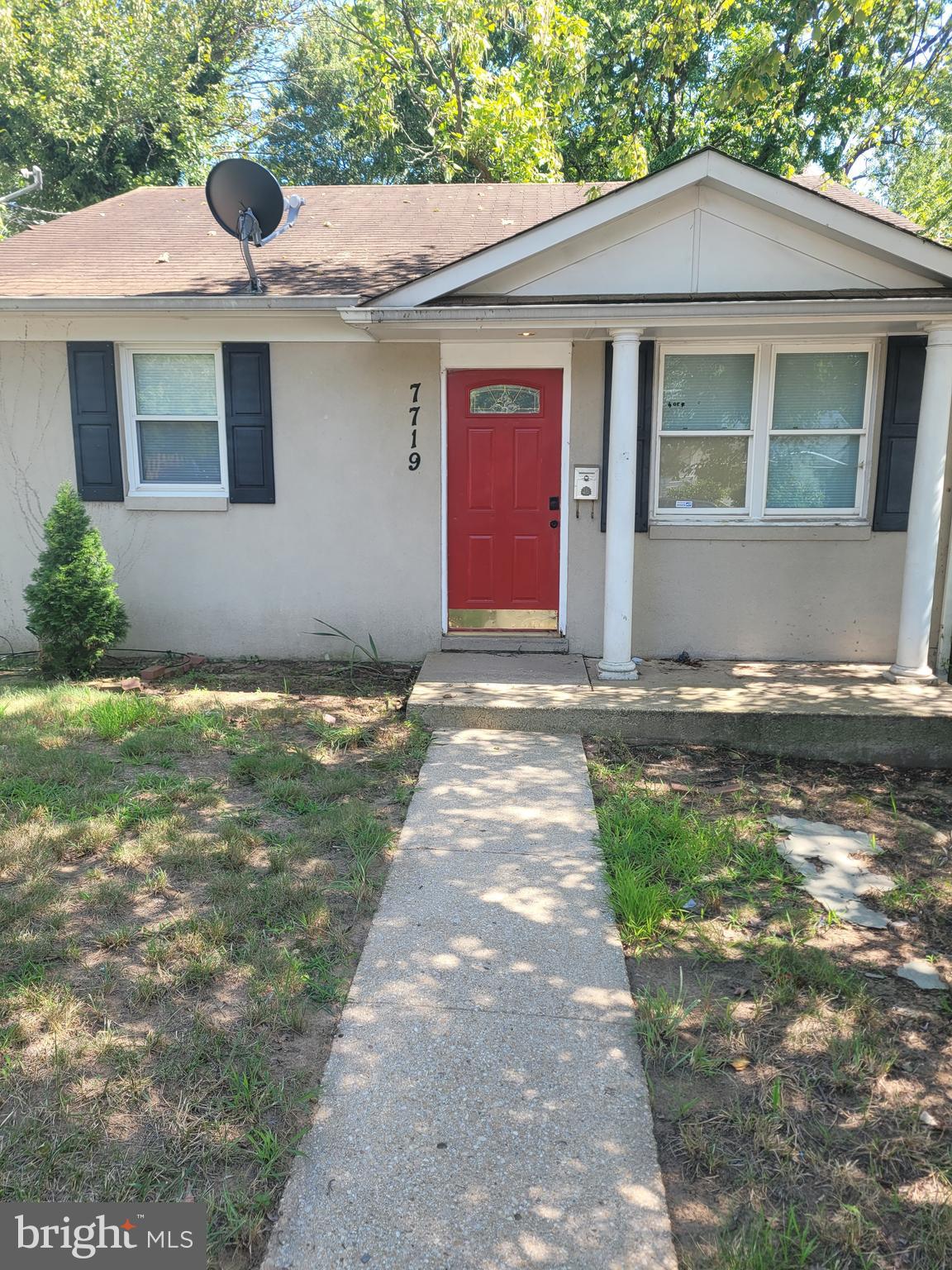 a front view of a house with yard