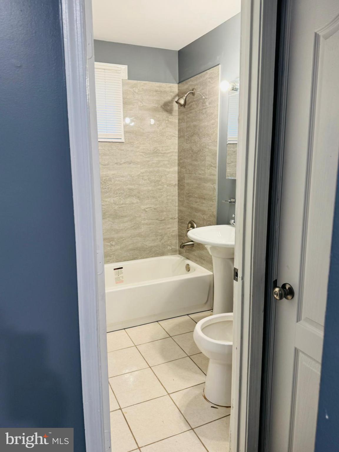 7719 Normandy Road Landover, MD 20785 - Photo 15 of 18 a bathroom with a bathtub and a toilet