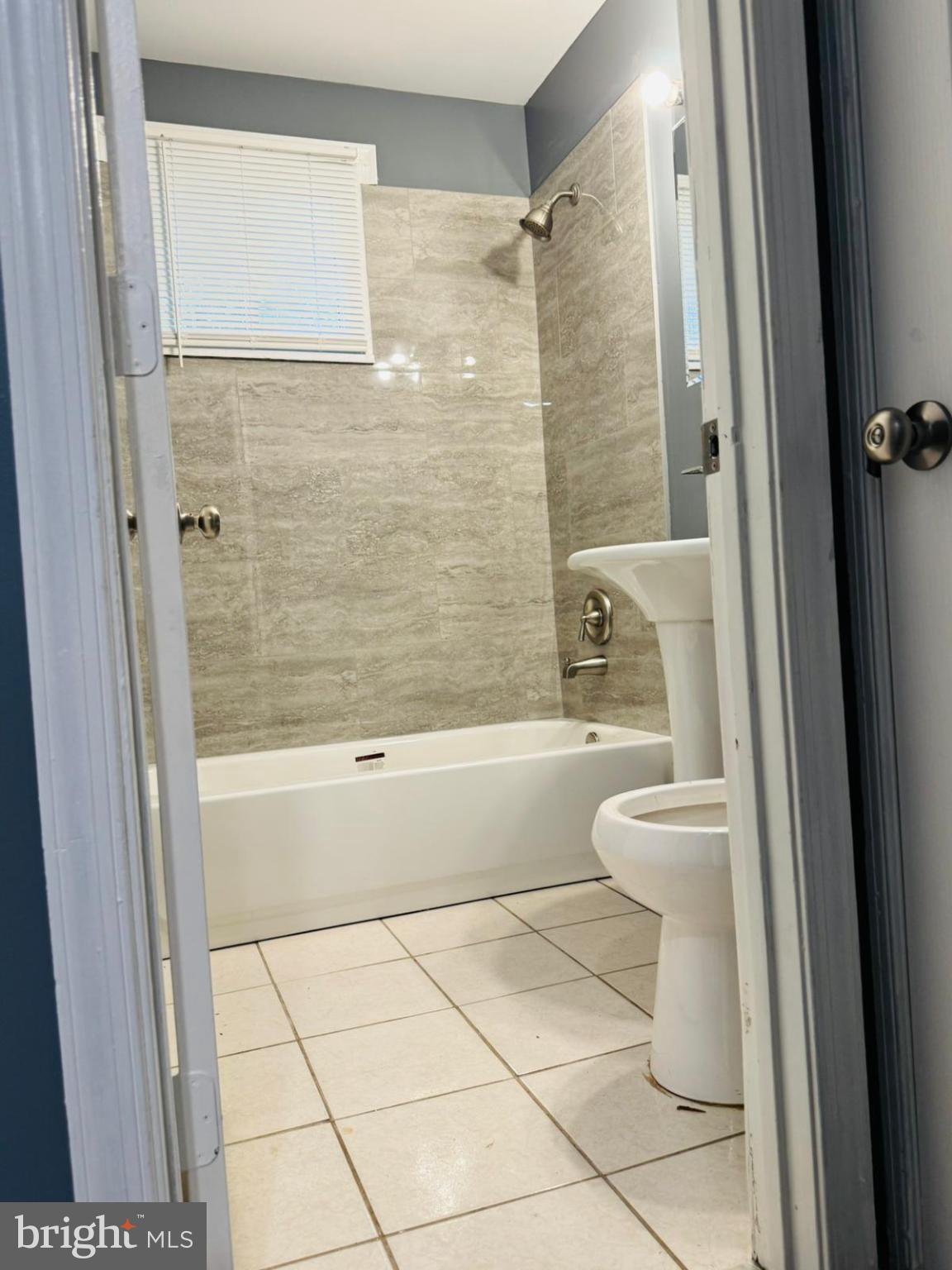 7719 Normandy Road Landover, MD 20785 - Photo 17 of 18 a bathroom with a toilet and a shower