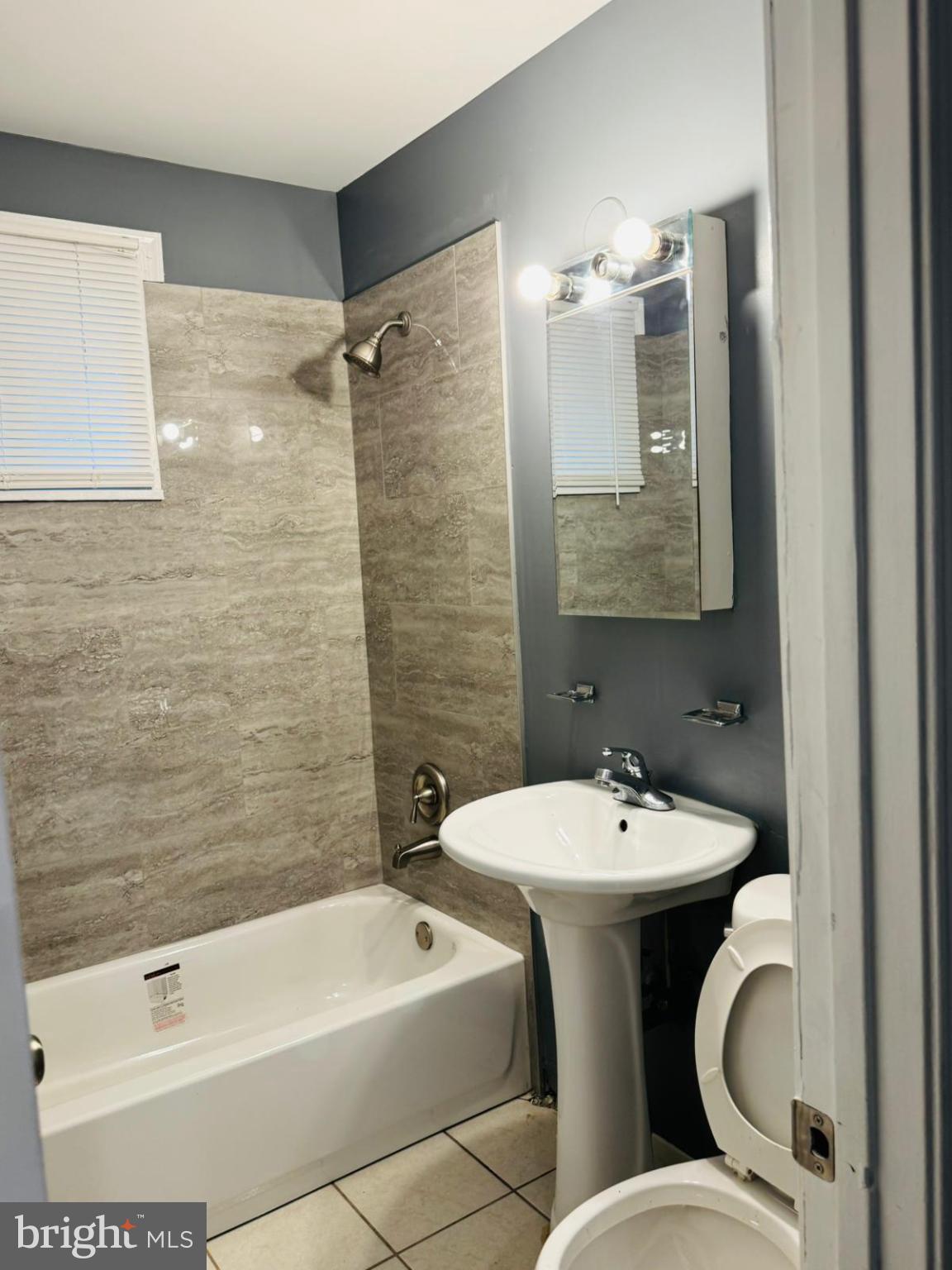 7719 Normandy Road Landover, MD 20785 - Photo 18 of 18 a bathroom with a sink toilet and shower