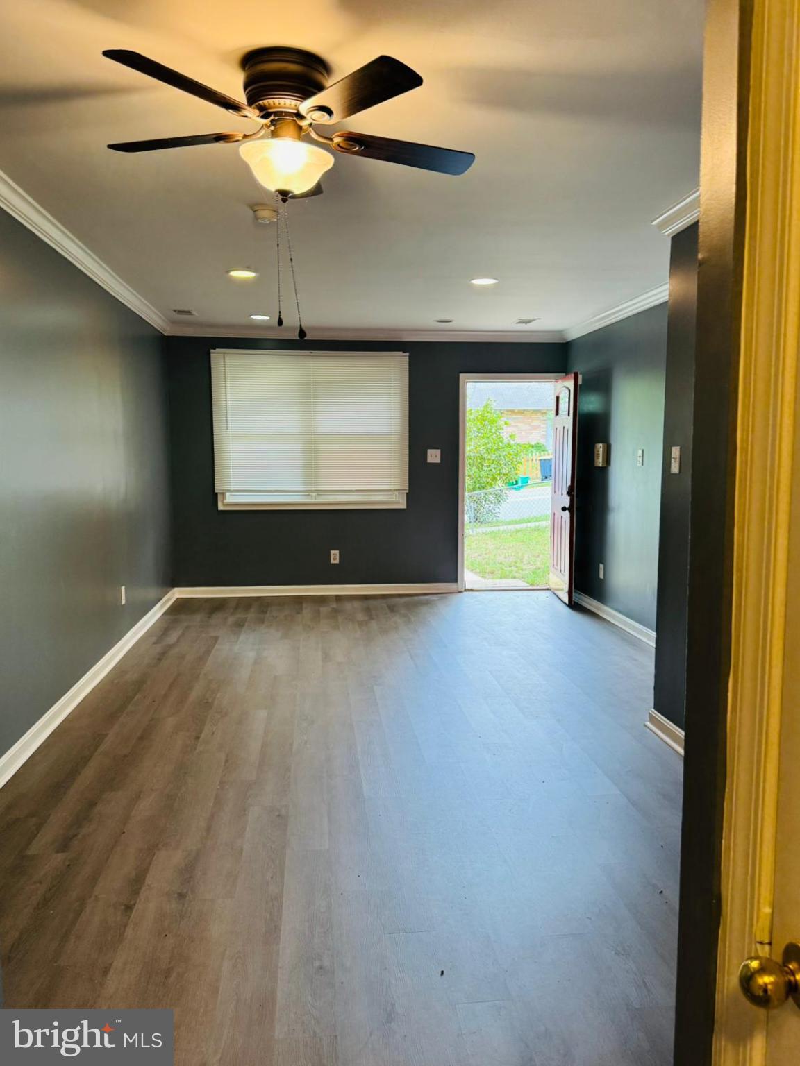 7719 Normandy Road Landover, MD 20785 - Photo 2 of 18 a view of room with window and ceiling fan
