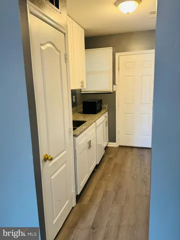 a kitchen with a refrigerator a stove top oven a sink and dishwasher