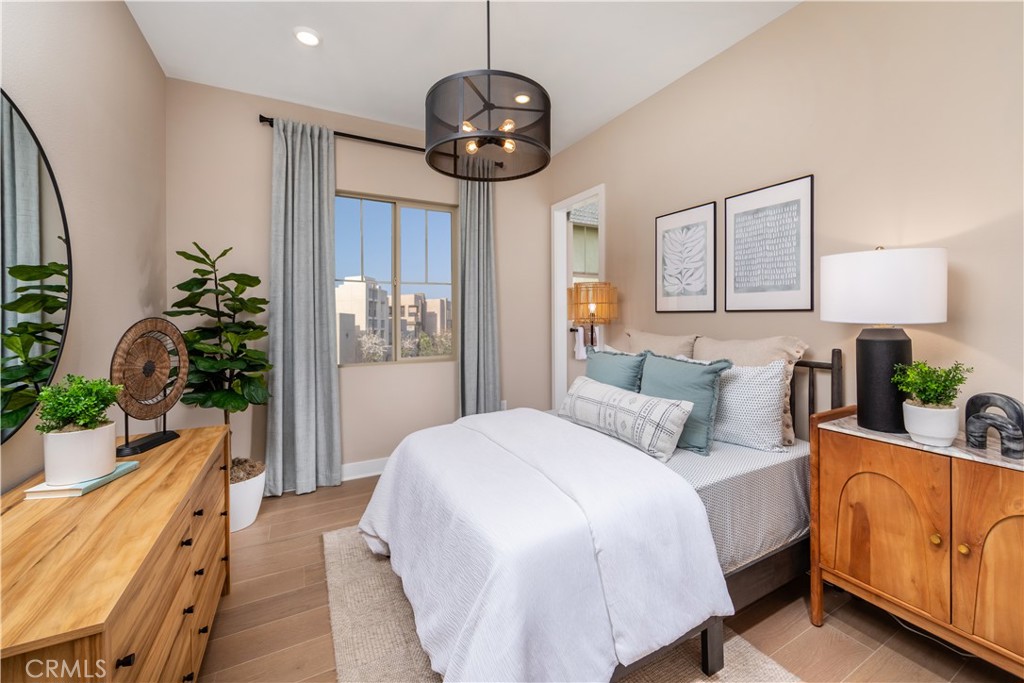 182 Carmine Irvine, CA 92618 - Photo 12 of 15 a bedroom with bed and a chandelier