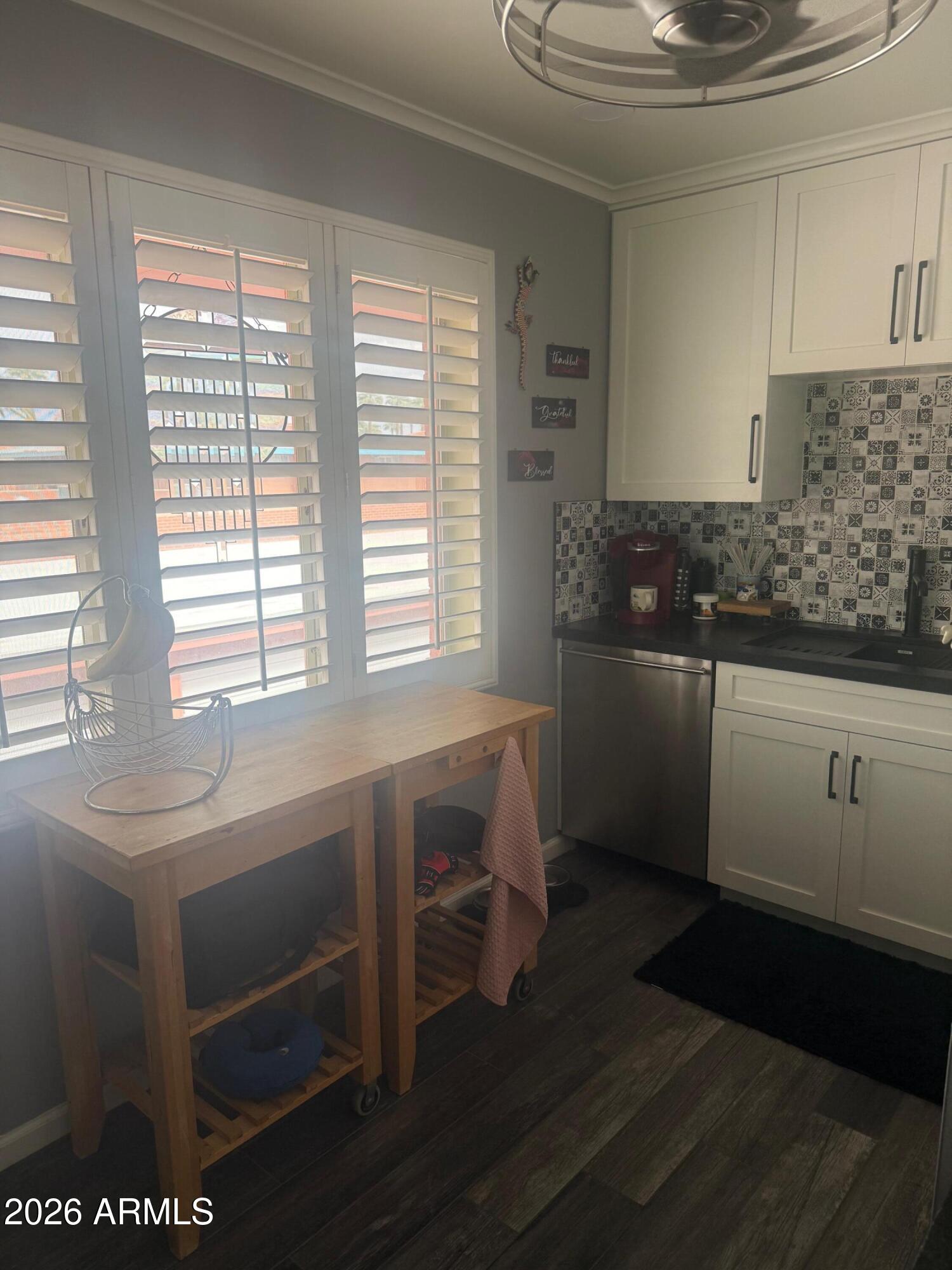 126 East Coronado Road, Unit 17 Phoenix, AZ 85004 - Photo 12 of 30 a kitchen with a sink and wooden cabinets