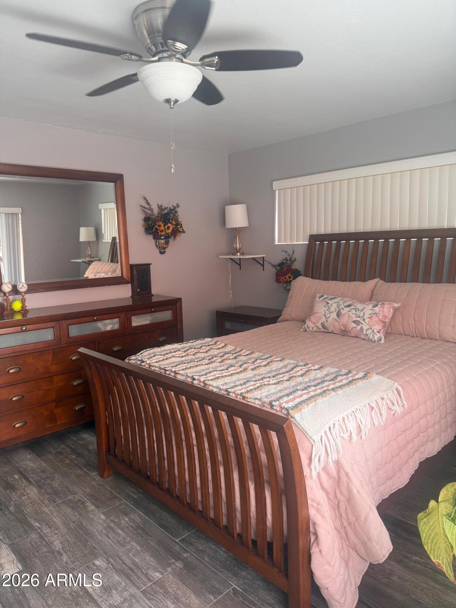 126 East Coronado Road, Unit 17 Phoenix, AZ 85004 - Photo 17 of 30 a bedroom with a bed and a chandelier