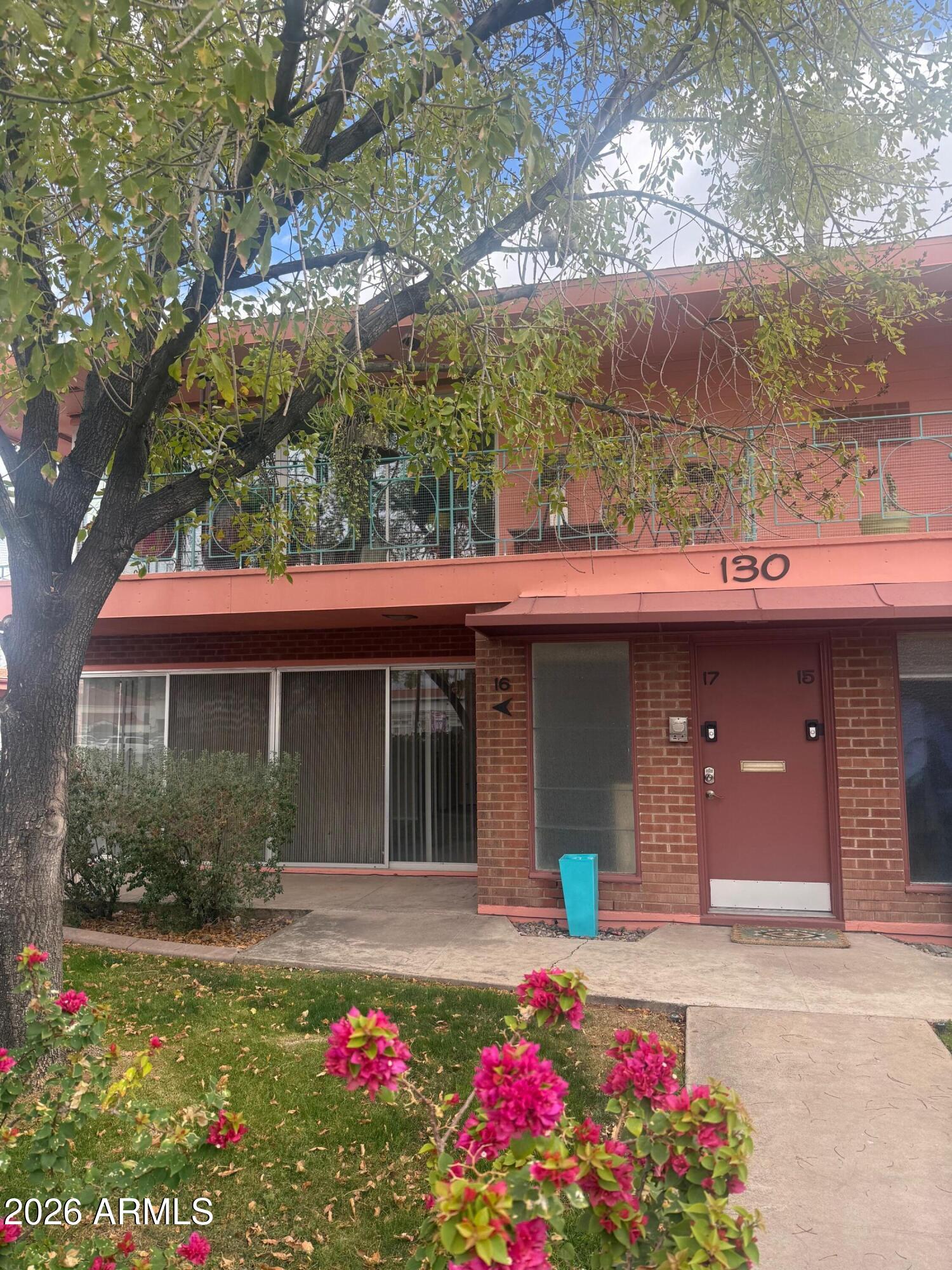 126 East Coronado Road, Unit 17 Phoenix, AZ 85004 - Photo 2 of 30 a view of a house with a yard and garage