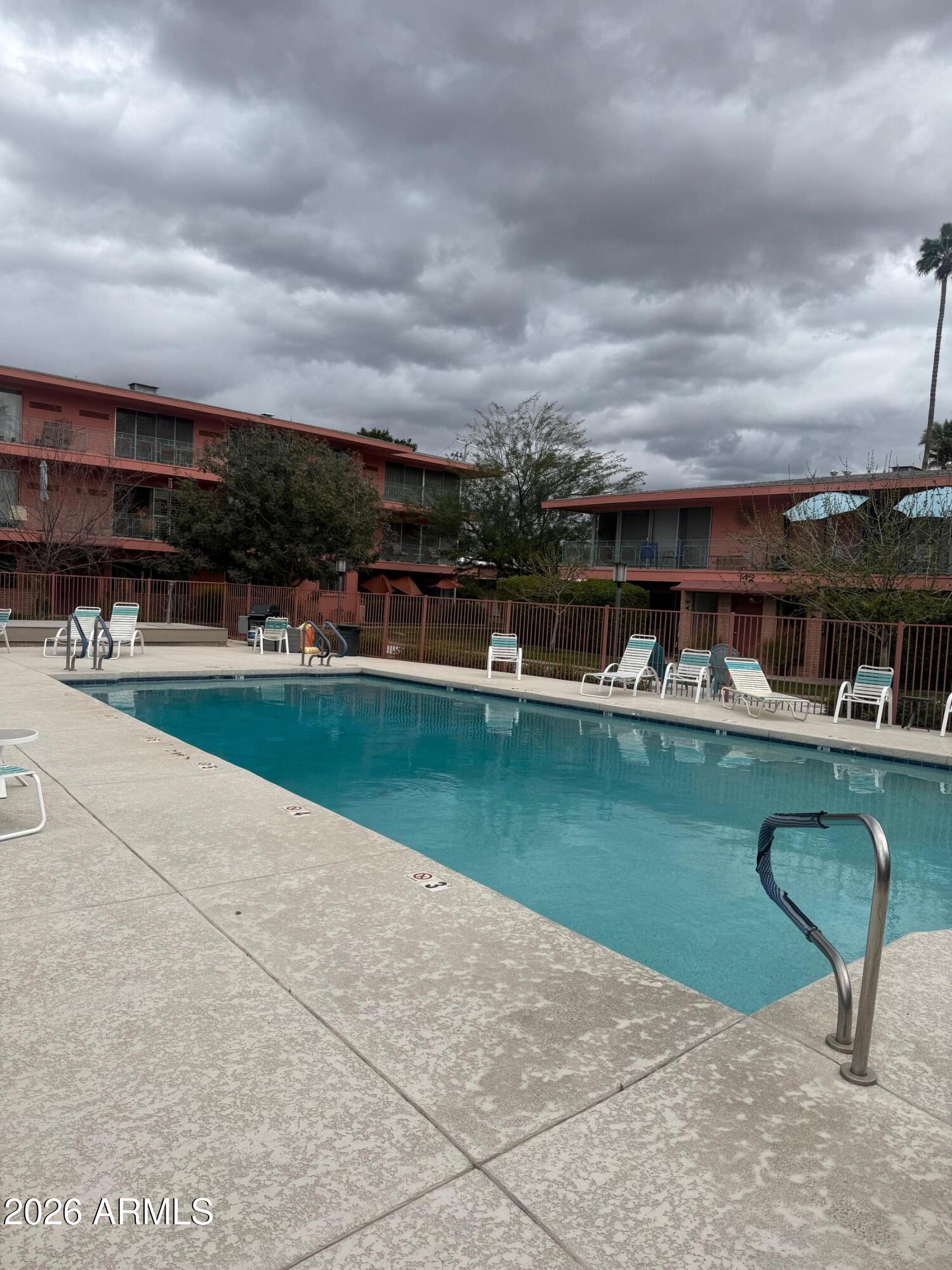 126 East Coronado Road, Unit 17 Phoenix, AZ 85004 - Photo 28 of 30 a view of a swimming pool with a yard