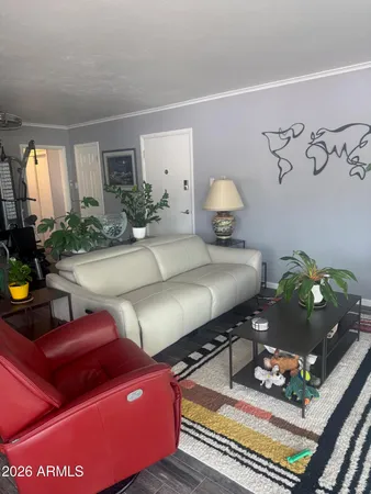 a room with furniture and a flat screen tv