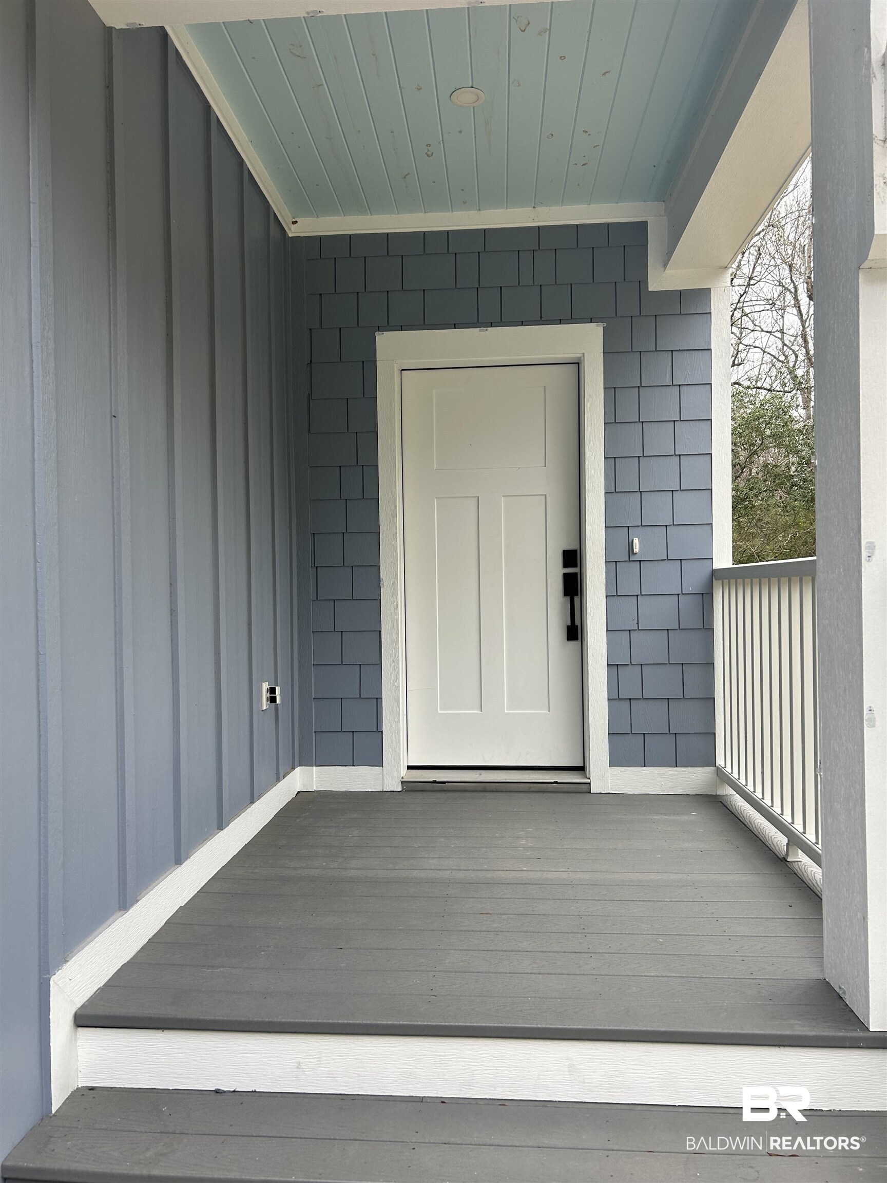5122 Pine Road Orange Beach, AL 36561 - Photo 3 of 24 Doorway to property featuring a deck and board and batten siding