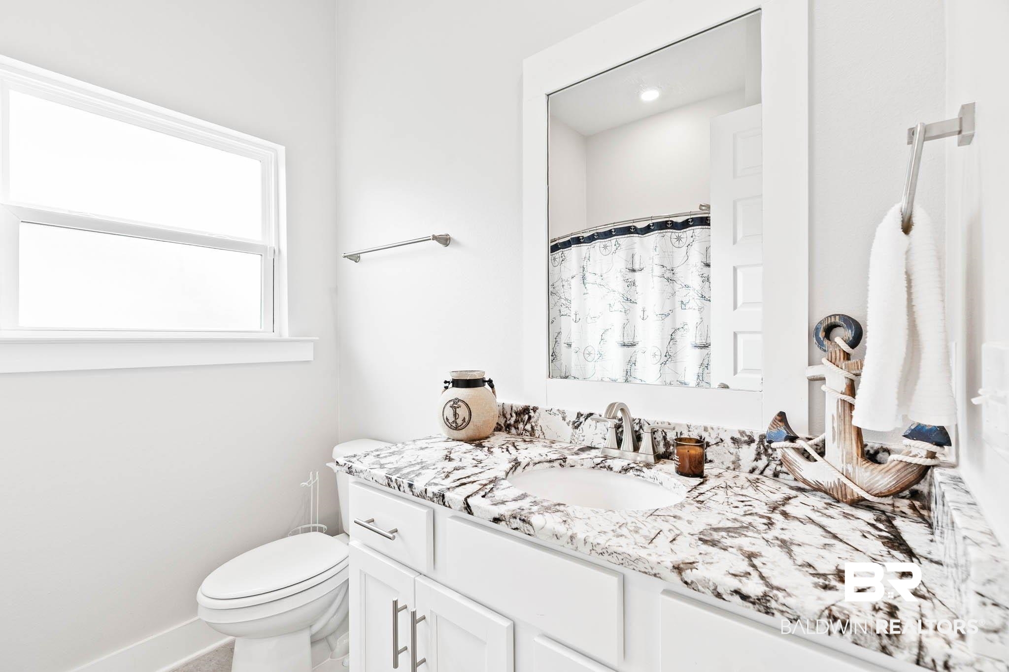 12785 Warbler Street Daphne, AL 36527 - Photo 23 of 53 Bathroom with vanity and a shower with shower curtain