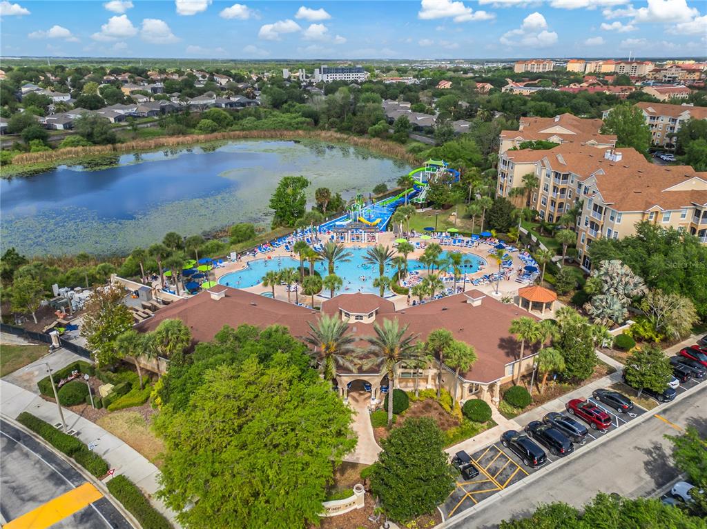 2817 Almaton Loop, Unit 301 Kissimmee, FL 34747 - Photo 1 of 51 an aerial view of lake and residential houses with outdoor space