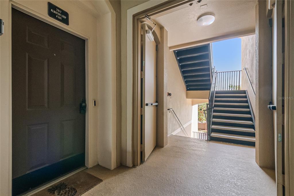 2817 Almaton Loop, Unit 301 Kissimmee, FL 34747 - Photo 36 of 51 a view of a hallway with closet and stairs