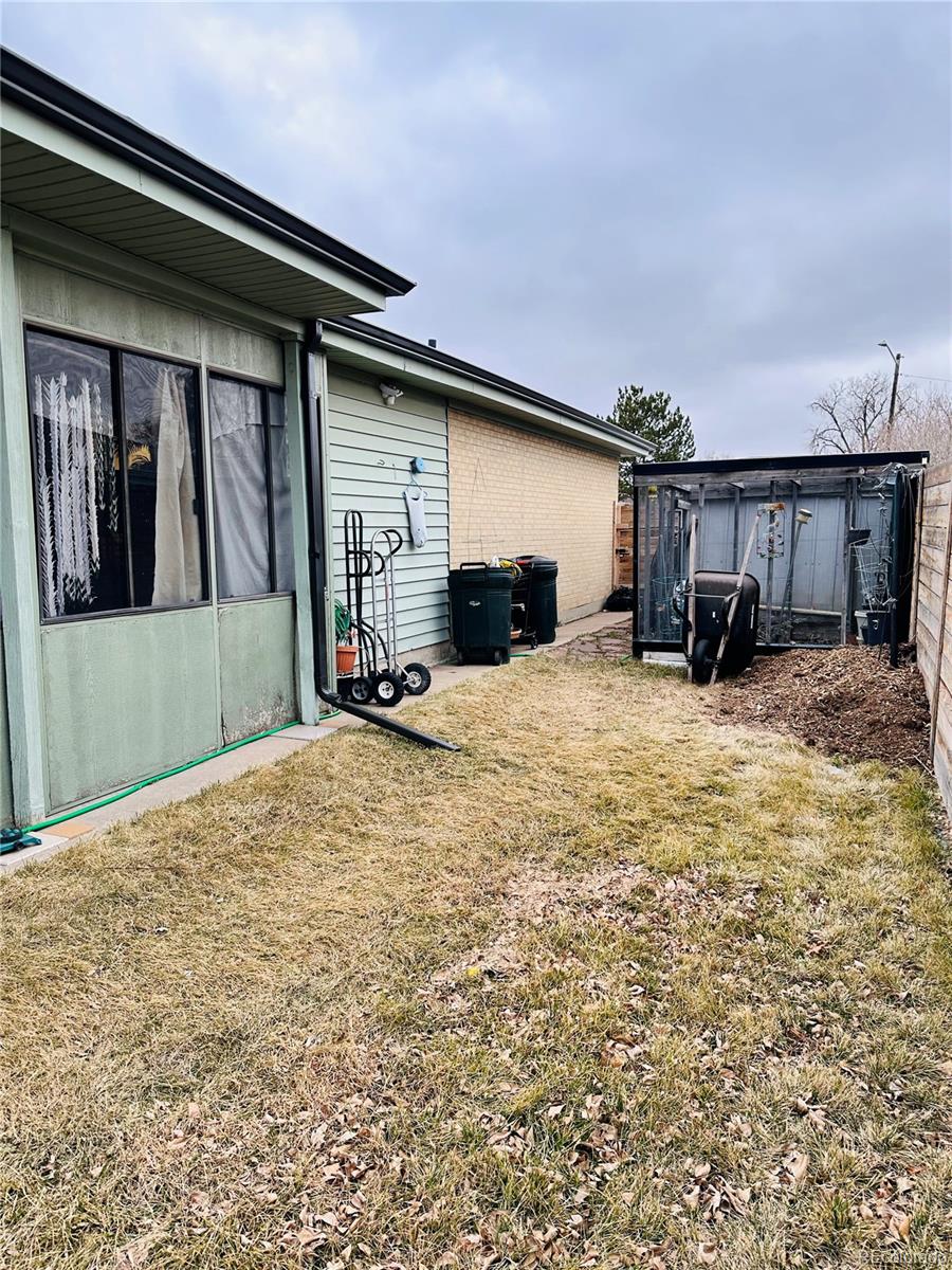 662 South Tejon Street Denver, CO 80223 - Photo 18 of 19 a view of a house with yard and roof