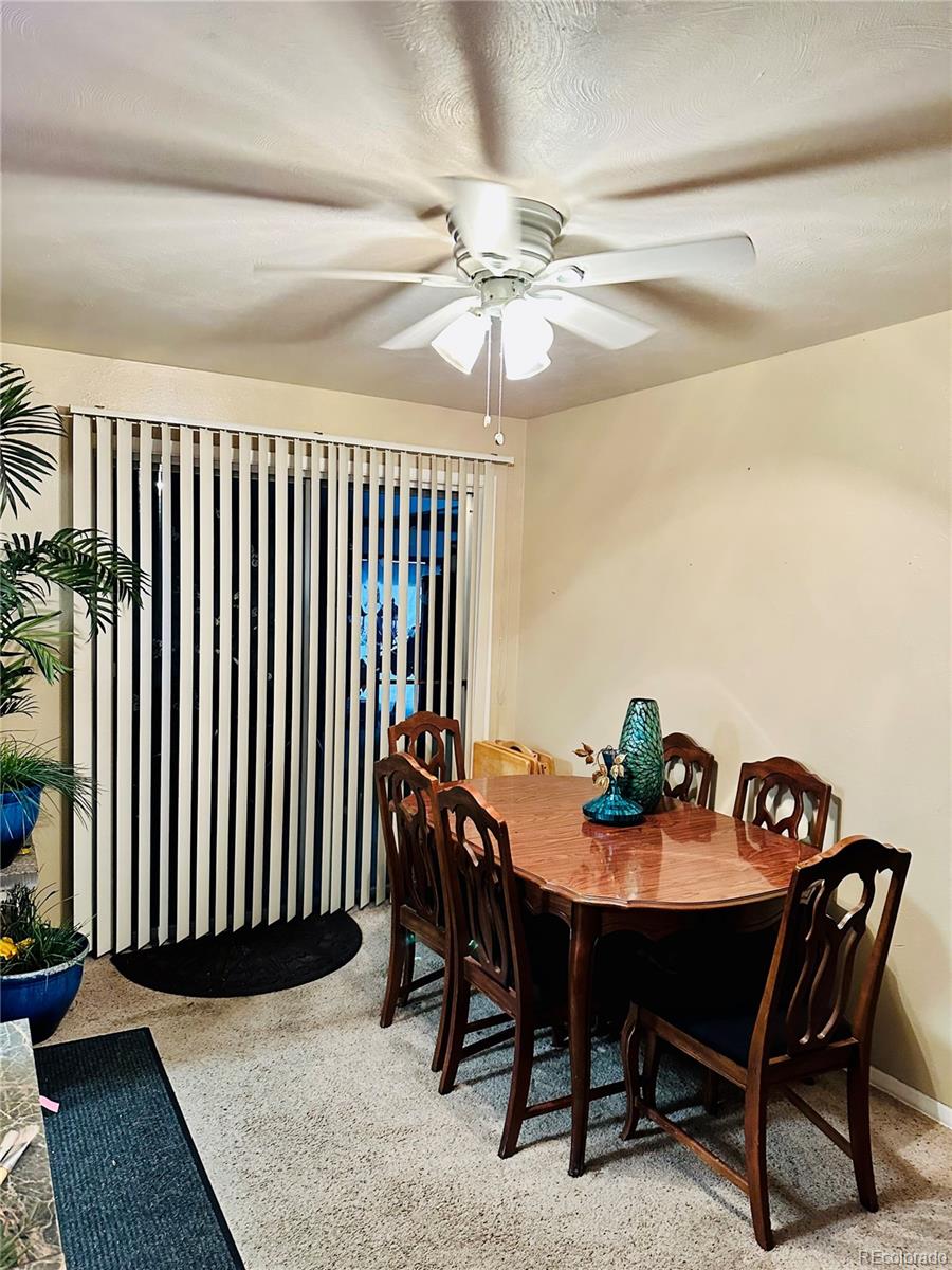 662 South Tejon Street Denver, CO 80223 - Photo 9 of 19 a view of a dining room with furniture and chandelier