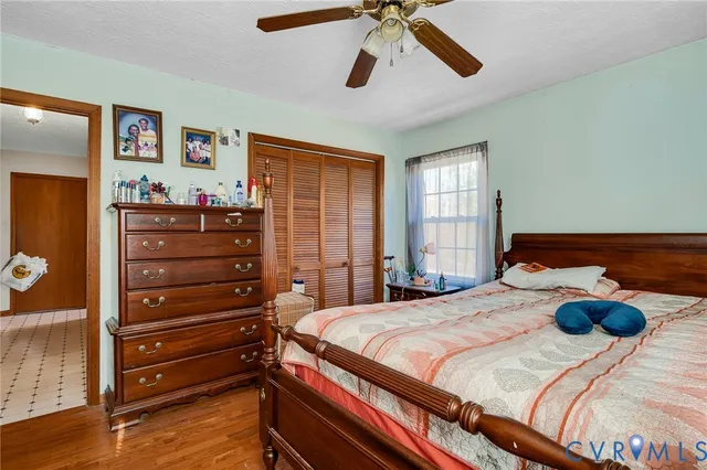 a bedroom with a bed and a dresser