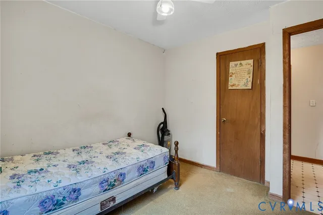 a bedroom with a bed and hallway