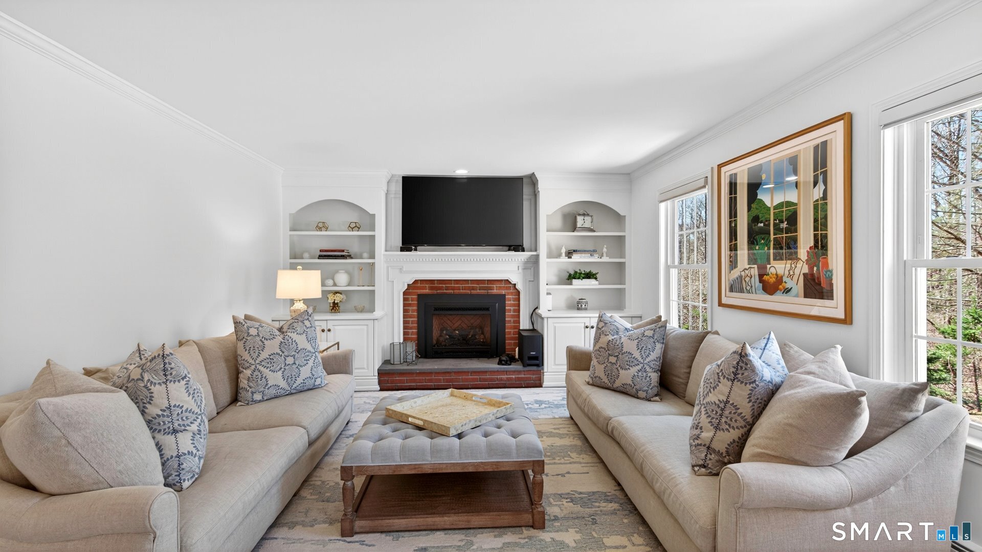 389 Huckleberry Hill Road Avon, CT 06001 - Photo 12 of 35 Family room with gas fireplace and built-ins.