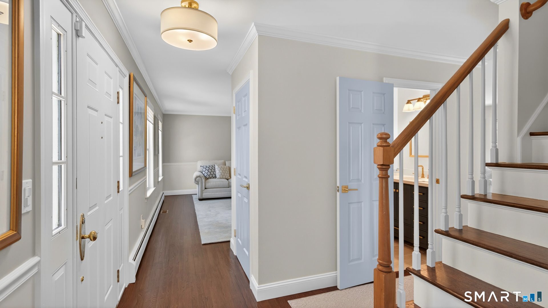 389 Huckleberry Hill Road Avon, CT 06001 - Photo 17 of 35 Main hallway with renovated powder room and stairs to the upper level.