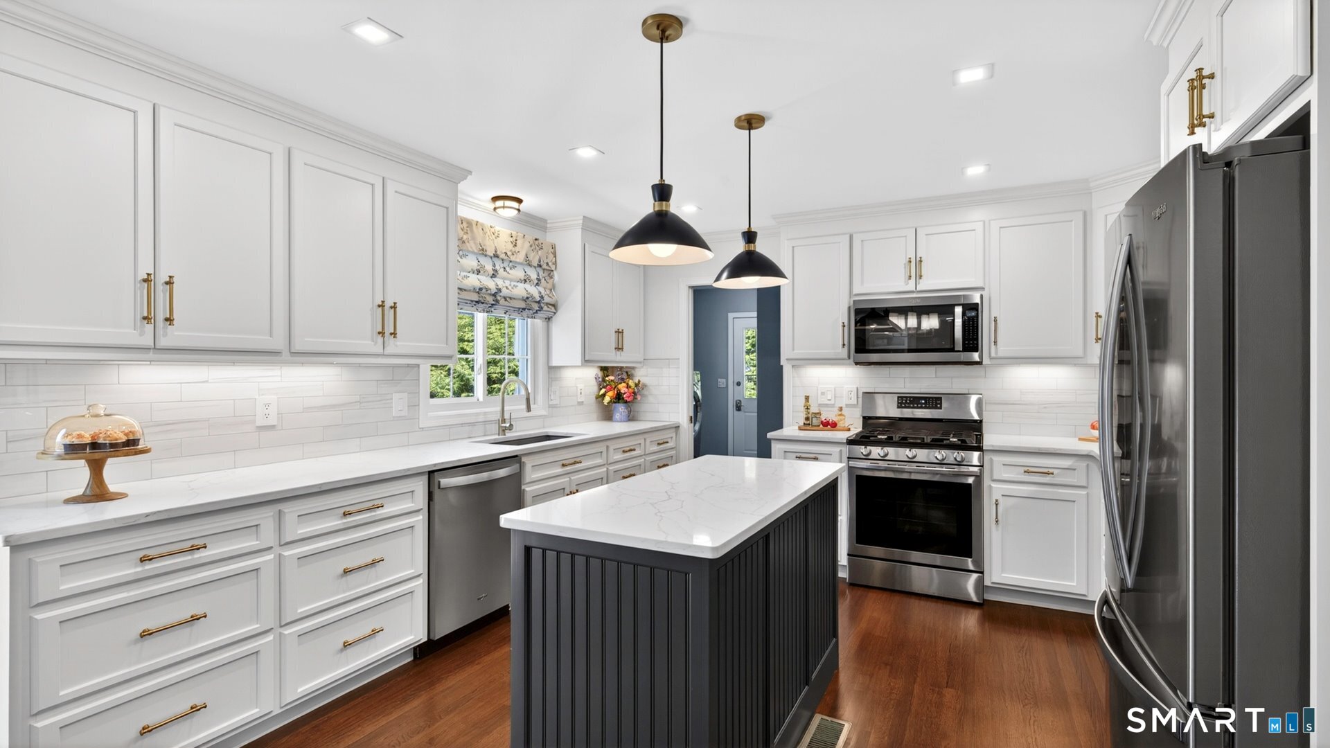 389 Huckleberry Hill Road Avon, CT 06001 - Photo 4 of 35 Stunning 2025 kitchen renovation with quartz countertops & custom cabinetry.