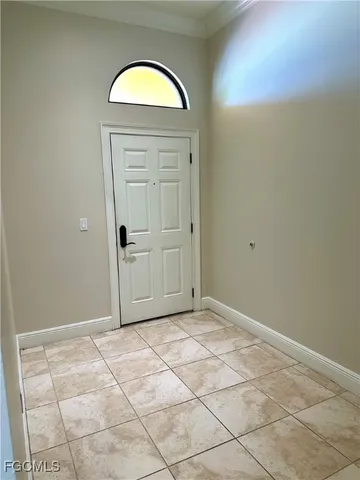 an empty room with mirror